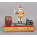 A cast iron Trick Dog money box.