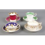 A collection of four Rockingham teacup and saucers sets. Two bearing puce griffin and two bearing