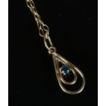 A 9ct gold aquamarine pendant on chain set in teardrop shaped mount. Total weight 1g.