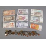 A quantity of coins and bank notes from various countries including Belgium, Uzbekistan, Austria,