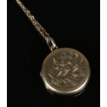 A 9ct gold locket and chain featuring floral engraved decoration. 4.2g.