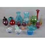 A collection of assorted coloured glassware to include cranberry glasses, bubble vases, baskets,