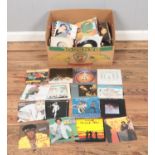 A box of most 1970's and 80's vinyl singles including black label singles. Examples include