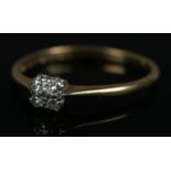 An 18ct gold five stone diamond cluster ring. Size P, 1.8g.