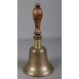 A brass school bell with turned wooden handle. (25cm)