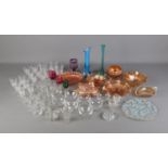 A box of glassware including carnival glass pieces as well as coloured glass vases, cut glass and