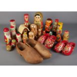 A large quantity of Russian Dolls along with three pairs of Clogs. Includes religious examples, etc.