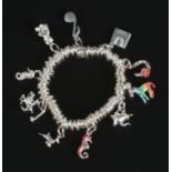 A Links of London silver ring charm bracelet with 10 silver charms including zebra, teapot,