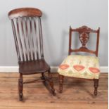 A spindle back rocking chair along with upholstered hall chair with carved floral supports.