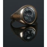 A 9ct Gold Hematite Intaglio signet ring. Inscription on the inside of the band '14/9/63 Myra-