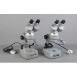 Two Kyowa Tokyo binocular microscopes; model SDZ-PL. Numbers 772396 and 771844. Replacement glass