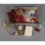 A gilt framed dressing table tray with contents of costume jewellery and collectables. To include