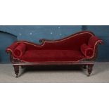 A Victorian carved mahogany chaise lounge. Height 93cm, Length 203cm, Depth 63cm. Back castor