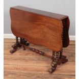 A mahogany Sutherland drop-leaf table raised on bobbin turned supports. Approx. dimensions 108cm x