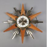 A Bentima Battery starburst wall clock.