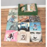 A collection of assorted vinyl records of mainly pop and rock to include Phil Collins, Elton John,