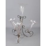 A Victorian white metal and glass Epergne featuring four etched glass flutes.