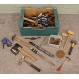 A box of tools. Includes Rabone tape measure, axe, Stanley examples, wood planes, etc.