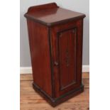 A Victorian carved mahogany bedside cabinet. (93cm x 42cm)