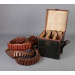 A Leather, canvas and brass cartridge box with internal leather lifting straps with three