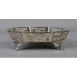 A silver bon bon dish of octagonal form, with pierced decoration, on four feet. Assayed for