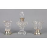 A collection of silver footed and collared glassware. To include cigarette bowl, scent bottle and