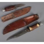 Two hunting knives with leather sheath. Includes horn handled example, etc. CANNOT POST OVERSEAS.