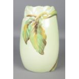 A Clarice Cliff autumn leaf pattern vase with green glaze.