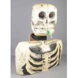 A paper mache model formed as a skeletons head and torso. (68cm)