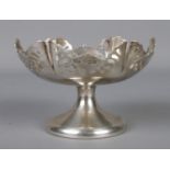 A silver bon-bon dish, with pierced and shaped edge, on footed base. Assayed Sheffield, 1954, by