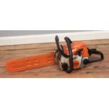 A Stihl MS180C chainsaw.