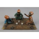 In the manner of Franz Bergman, an Austrian cold painted bronze figure group, three boys playing