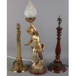 Three table lamps. Includes gilt metal example formed as a cherub holding a torch, etc.