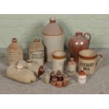 A collection of stoneware flagons, pots and hot water bottles including Rotherham and Sheffield