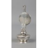 A miniature silver oil lamp figure, stamped 925 to reverse. Approx. height 7.5cm. Silver weight 26.