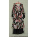 A John Bates for Jean Varon floral maxi-dress featuring bell sleeves, fitted bodice and full skirt