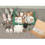 A box of miscellaneous. Includes figures, bust of Anubis, Royal Crown Derby Poises, set of silver