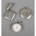 A collection of silver to include vesta case, compact and ladies pocket watch. Hallmarked Birmingham