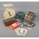 A box of collectables. Includes Spinney scales, Bowler mechanical counter, Tarot cards, Casio Quartz