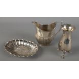 Three pieces of silver. Includes trinket dish with repousse decoration, Mappin & Webb jug and