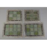 Four lead lined stained glass windows, of two sizes. Largest: Height: 36cm, Width: 28cm. Some panels