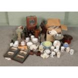 A large mix of collectables including wall clock, mixed glass bottles, commemorative tea cups/