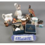 A quantity of ceramics. Includes Royal Crown Derby Pheasant, Beswick Koala, Nao by Lladro, Goebel,