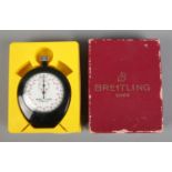 A Breitling Sprint 1/10s stopwatch in original plastic case, with toggle strap and branded Breitling