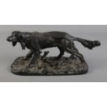 A cast iron figure of a spaniel, makers marks to base C1970's, 30cm long