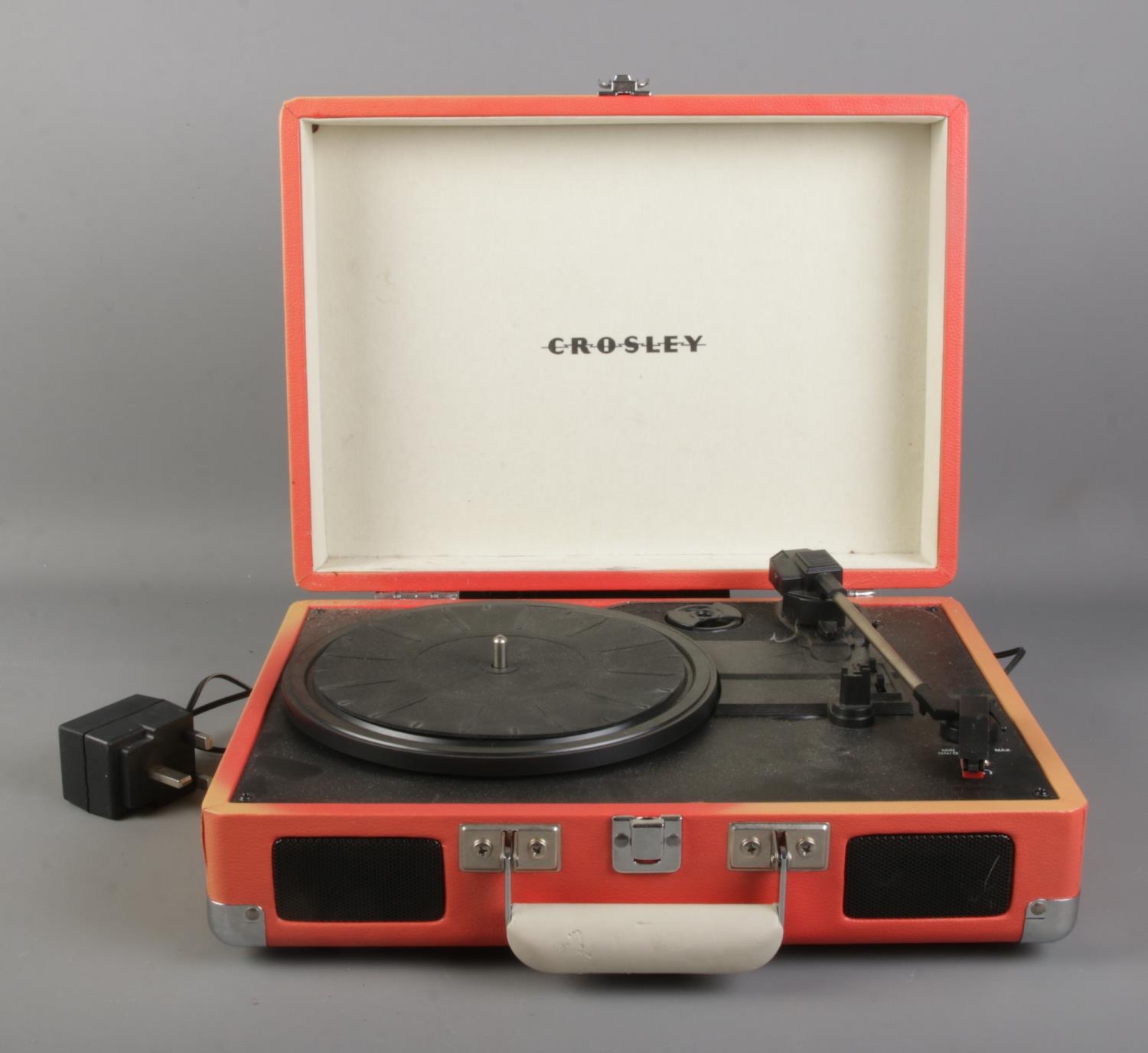 A Crosley portable record player. Model No. CR8005A-OR Working, will need plus replacing and shell
