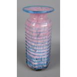 A pink Mdina Maltese glass vase featuring blue trailed pattern to exterior. Approx. height 20.5cm.