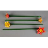 Four art glass flowers with long stems each of a different flower. Approx. stem length 47cm.