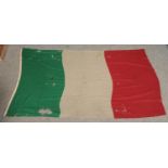 A large vintage Italian flag. Bears label for Unione Militare Roma. 218cm x 138cm. Various moth