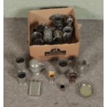 A box of assorted pewter and silver plate to include tankards, candlesticks, flasks etc.